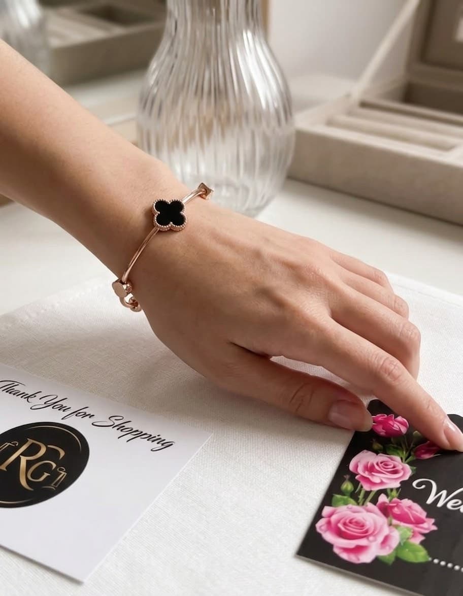 Title: Elegant Black Clover Charm Bracelet – Golden Finish
